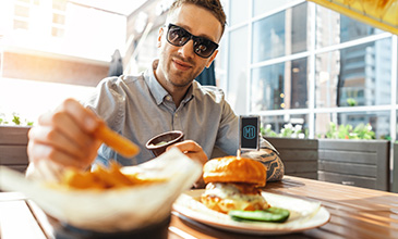 Guy eating fries