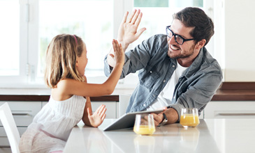 Man and child high fiving