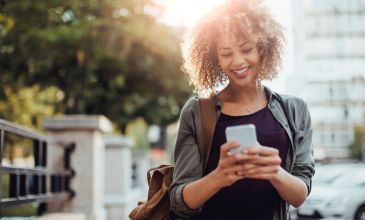 Woman looking at expenses on phone