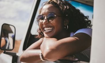 Woman in car smiling