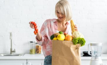 Woman putting away groceries