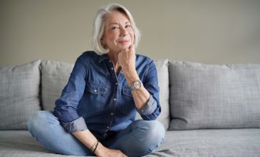 Woman sitting on coach